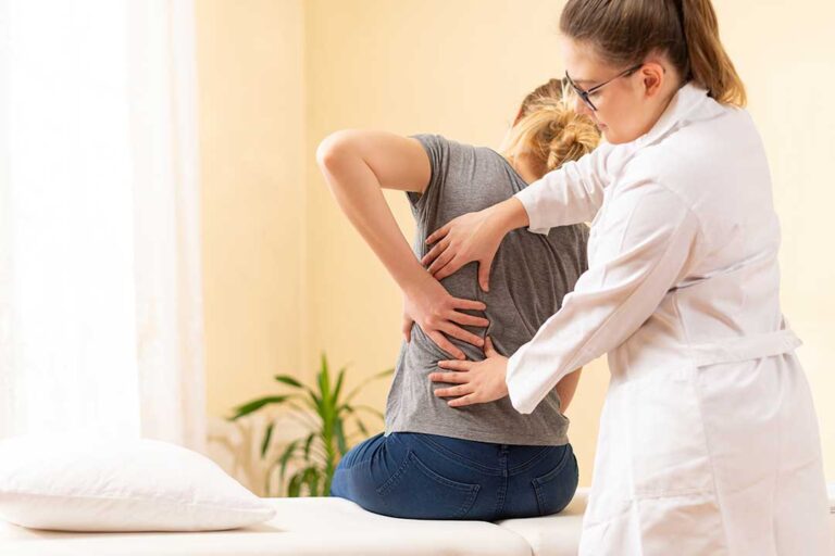 A healthcare provider gently assessing a person's neck in a calm, well-lit clinic setting.